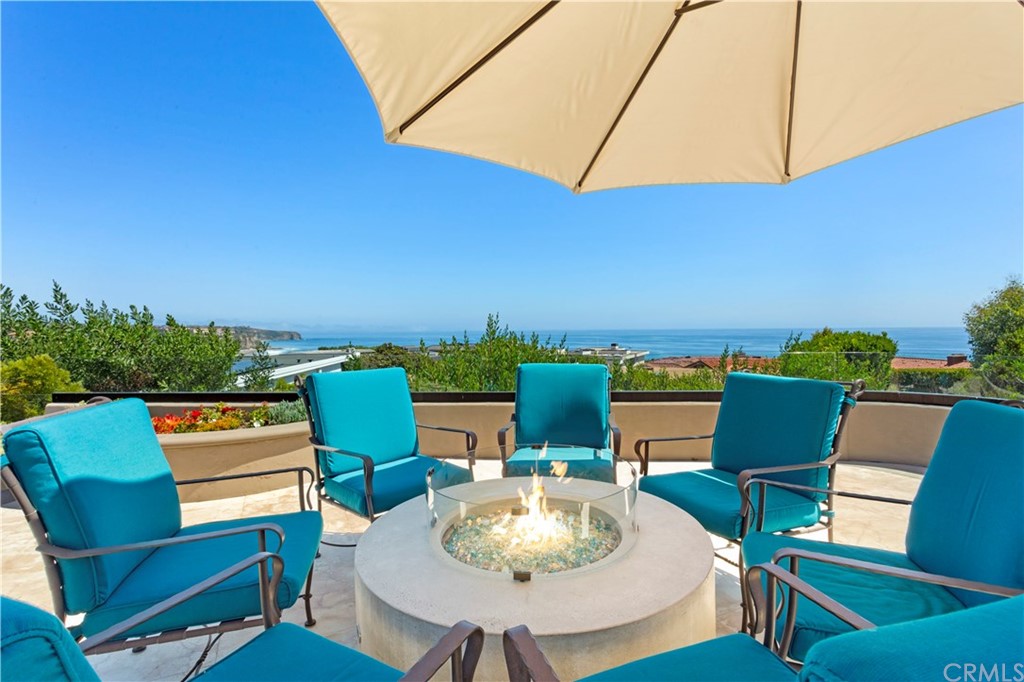 50 Monarch Bay Drive Dana Point, CA 92629 - Photo 6 of 34 a outdoor space with furniture and a umbrella