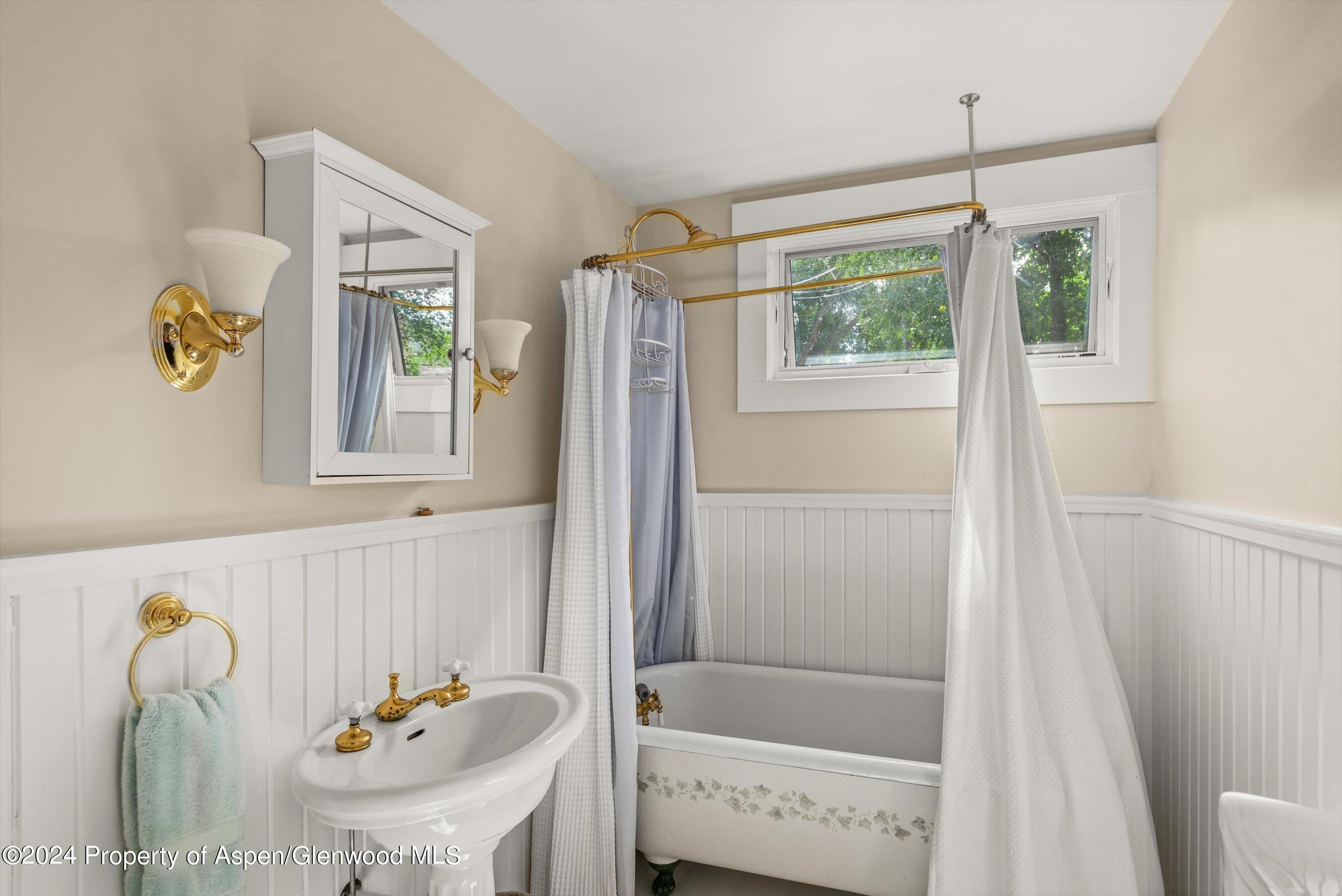 156 Garfield Avenue Carbondale, CO 81623 - Photo 14 of 24 a bathroom with a window and tub