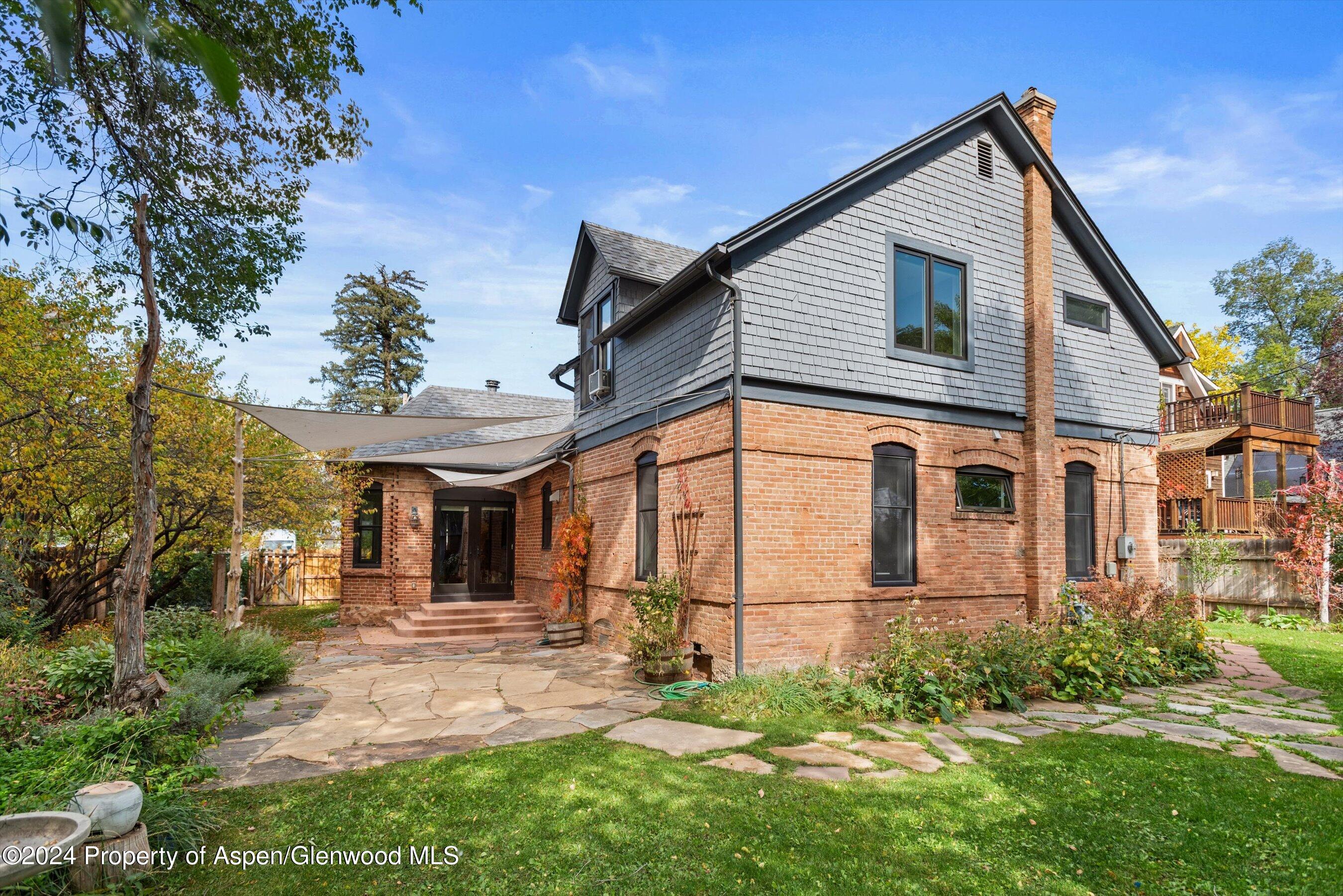 156 Garfield Avenue Carbondale, CO 81623 - Photo 18 of 24 a front view of a house with garden