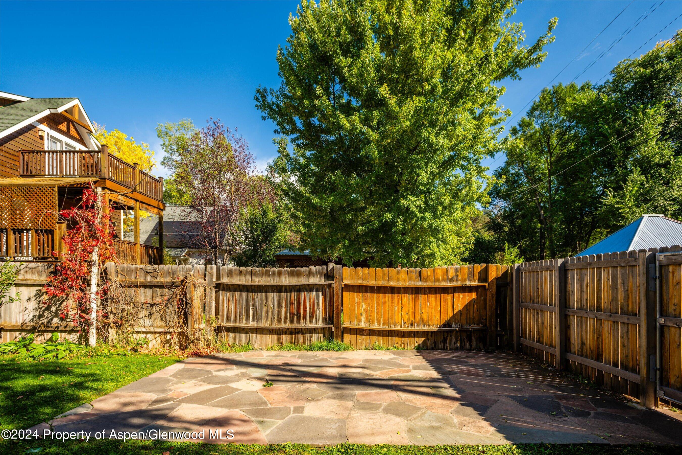 156 Garfield Avenue Carbondale, CO 81623 - Photo 20 of 24 a view of a white house with wooden fence