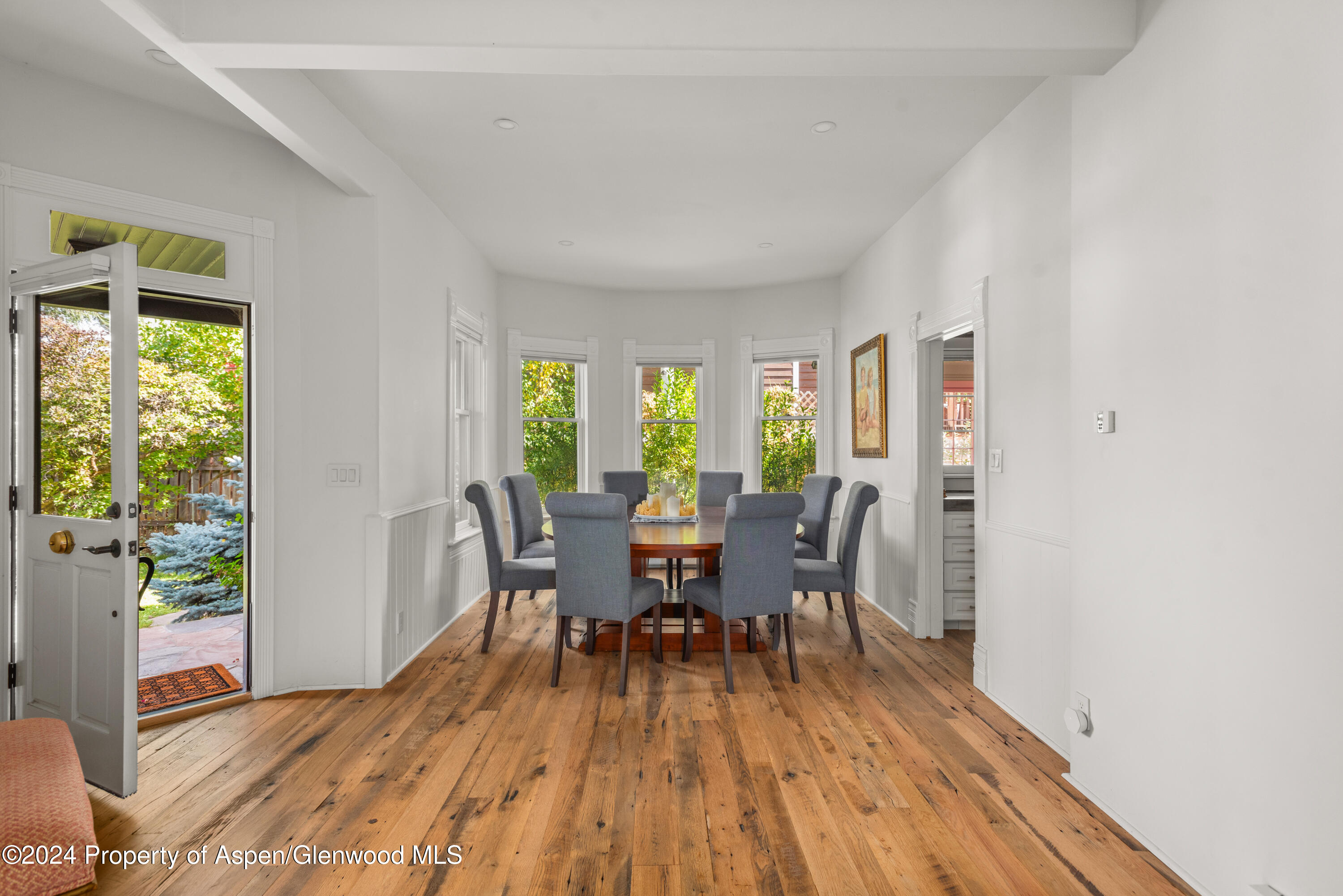 156 Garfield Avenue Carbondale, CO 81623 - Photo 10 of 24 a view of a dining room with furniture window and wooden floor