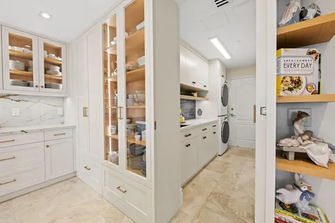 a bathroom with a double vanity sink and a bathtub