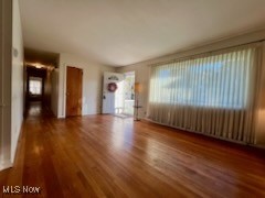 2375 Burnham Road Akron, OH 44333 - Photo 10 of 39 Unfurnished living room with dark hardwood / wood-style floors