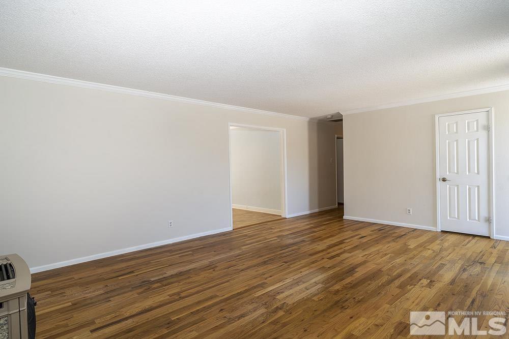 1531 Rayburn Drive Reno, NV 89503 - Photo 11 of 26 a view of an empty room with wooden floor