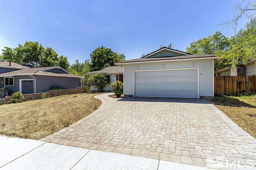 1531 Rayburn Drive Reno, NV 89503 - Photo 20 of 26 a front view of a house with a yard and garage