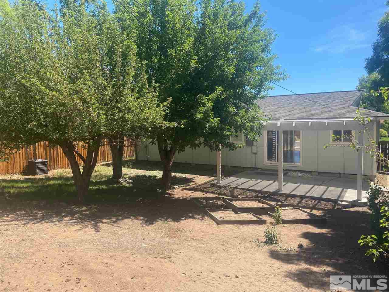 1531 Rayburn Drive Reno, NV 89503 - Photo 25 of 26 a backyard of a house with yard and tree