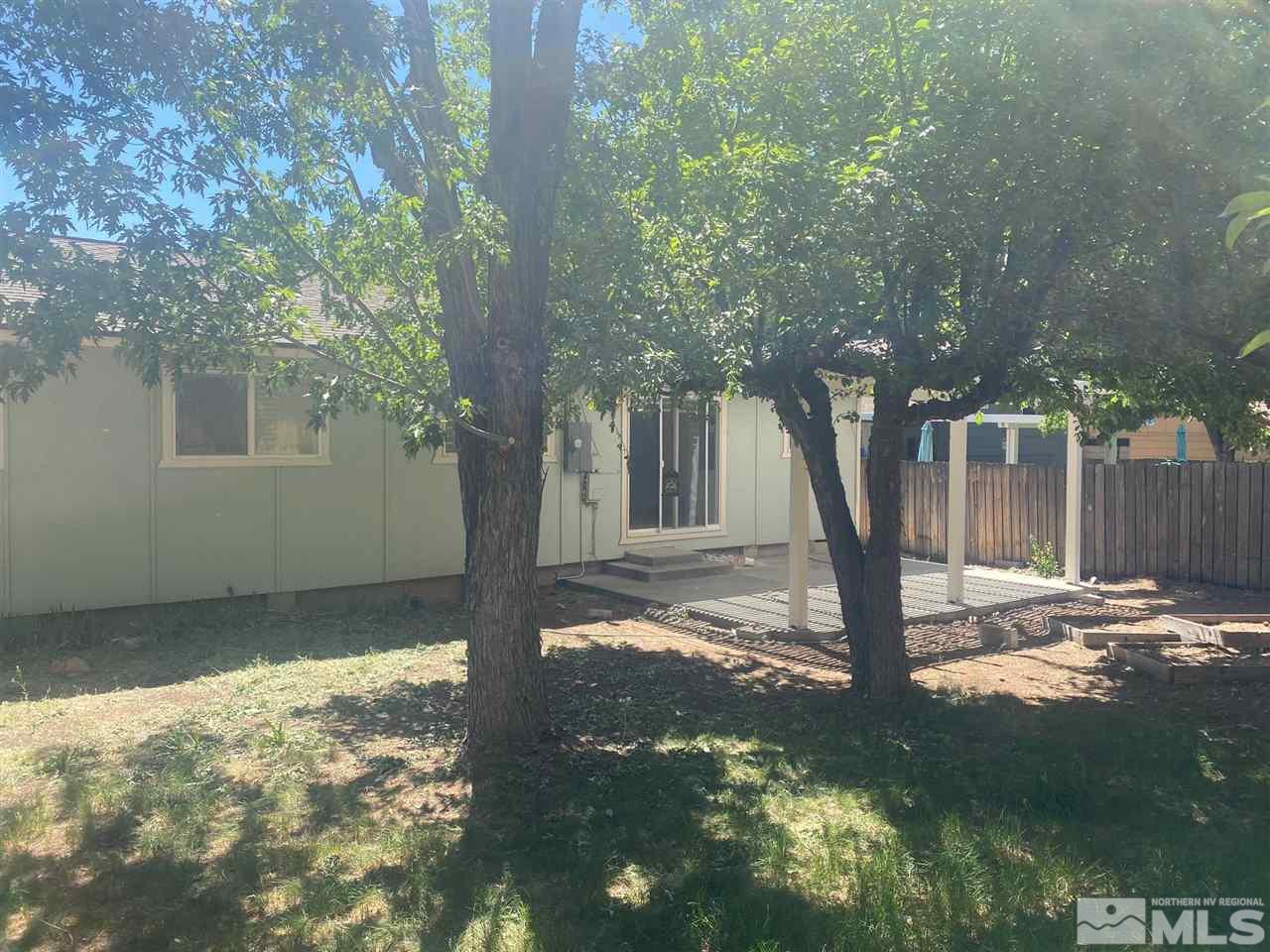 1531 Rayburn Drive Reno, NV 89503 - Photo 26 of 26 a view of a tree in the backyard of a house