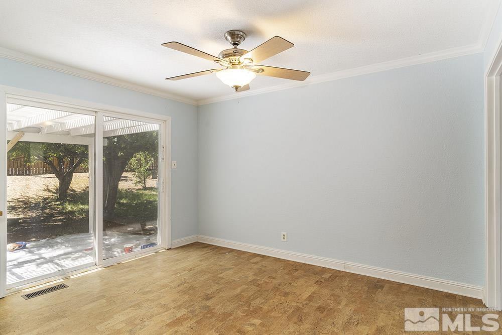 1531 Rayburn Drive Reno, NV 89503 - Photo 6 of 26 an empty room with window and a ceiling fan