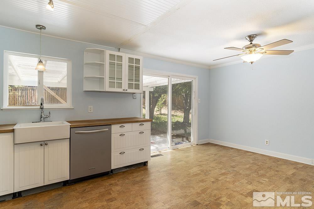 1531 Rayburn Drive Reno, NV 89503 - Photo 7 of 26 a kitchen with granite countertop a sink and a stove