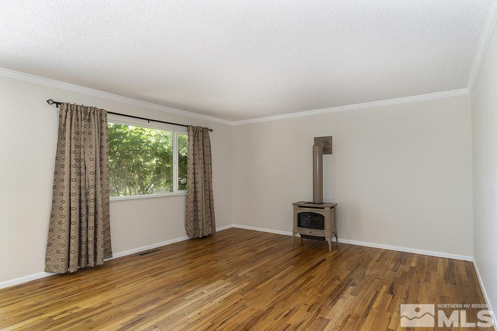1531 Rayburn Drive Reno, NV 89503 - Photo 10 of 26 wooden floor in an empty room with a window