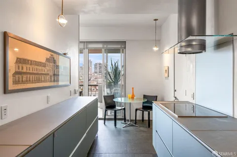 a kitchen with a sink and a refrigerator