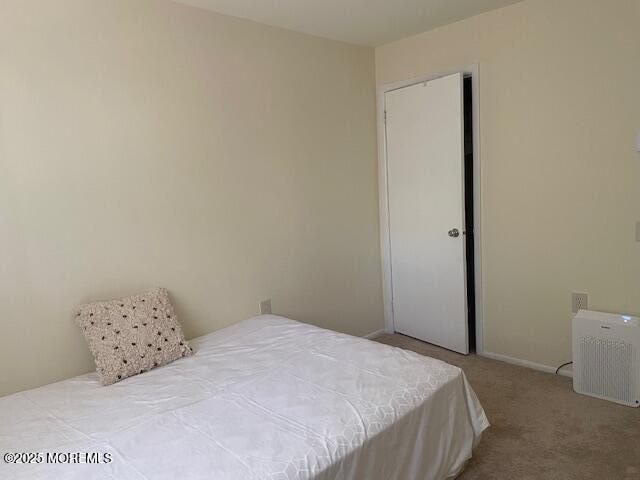 21 A Homestead Whiting, NJ 08759 - Photo 16 of 19 a bedroom with a bed and a lamp on the dresser