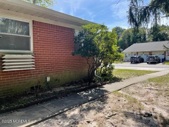 21 A Homestead Whiting, NJ 08759 - Photo 18 of 19 a view of a backyard with plants and a tree