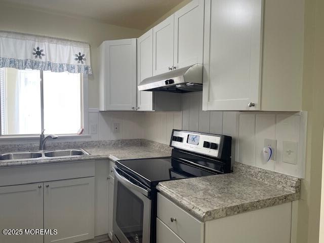 21 A Homestead Whiting, NJ 08759 - Photo 6 of 19 a kitchen with granite countertop a sink stove and cabinets