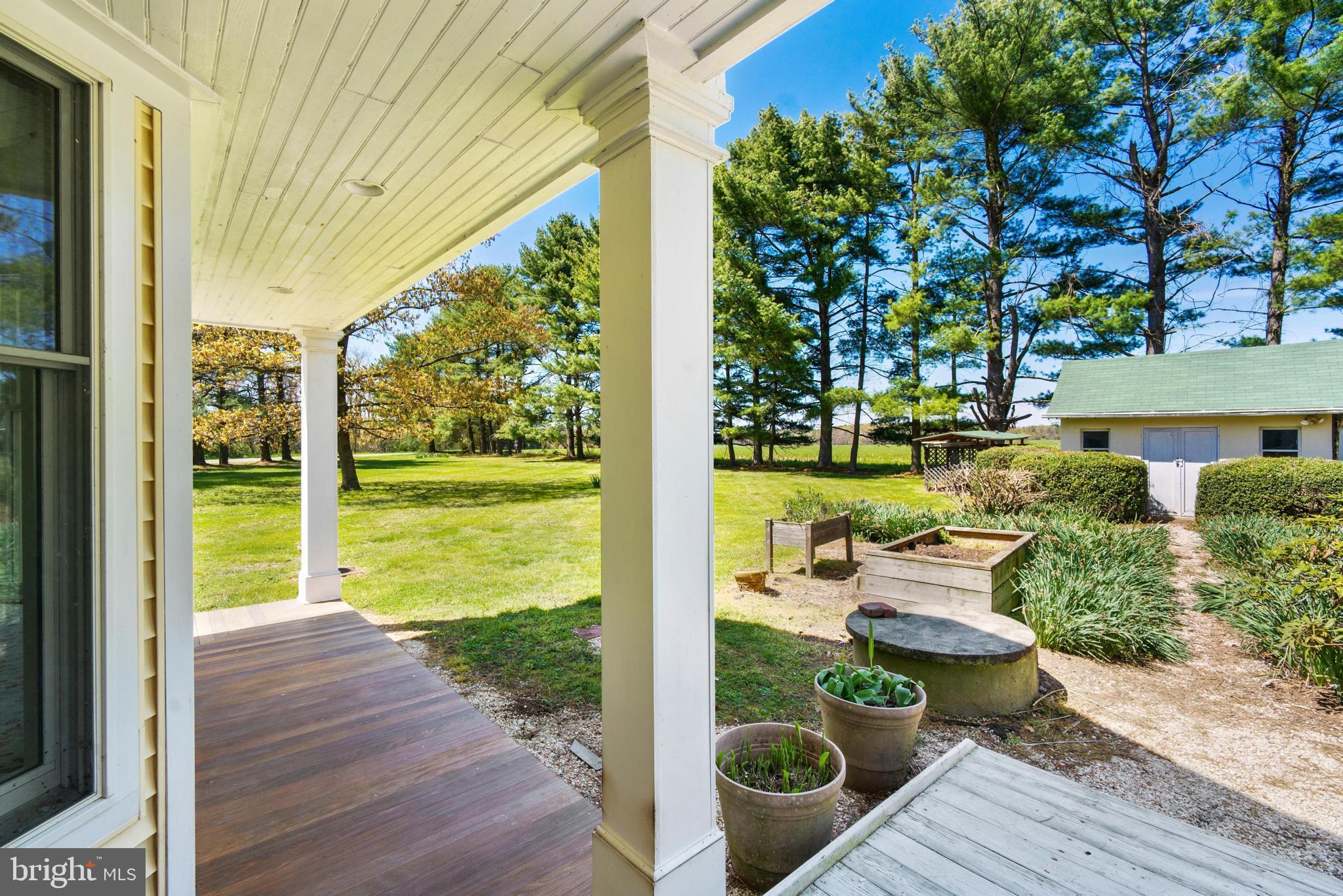 5184 Edesville Road Rock Hall, MD 21661 - Photo 35 of 48 Hardwood porch/deck leading to gardens