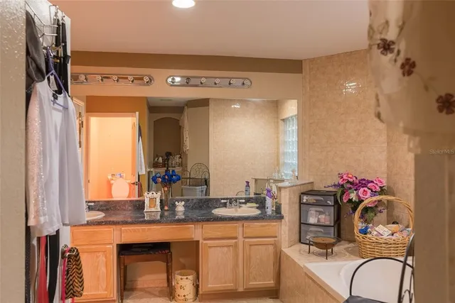 a bedroom with a bed and a dresser in it