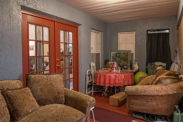 a view of a house with backyard sitting area and garden