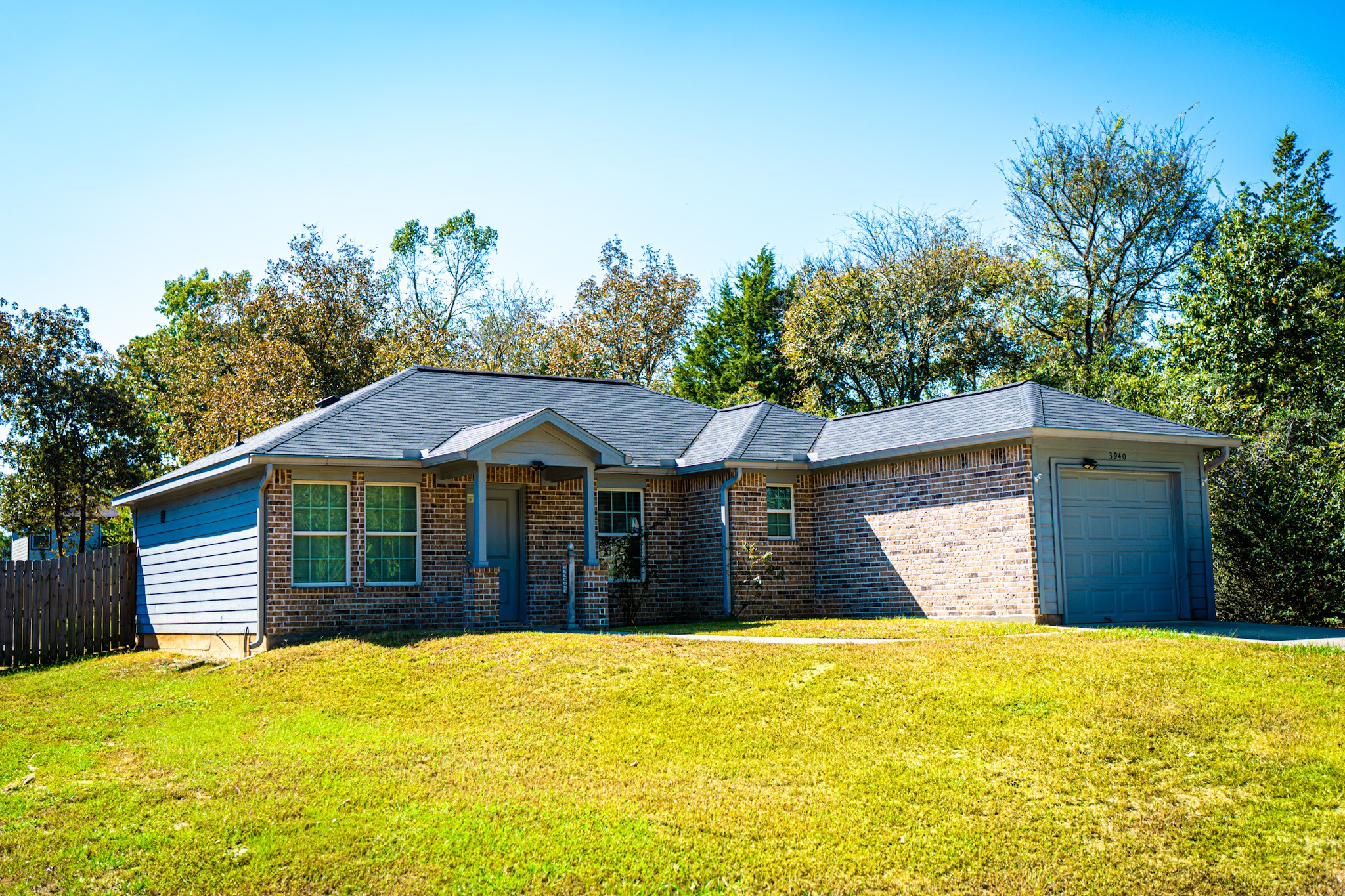 3940 Frontier Road Willis, TX 77378 - Photo 1 of 13 a front view of a house with a garden