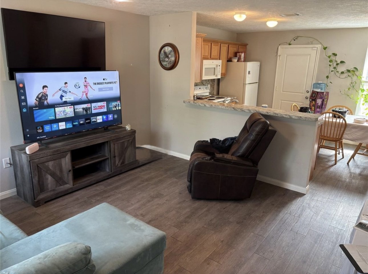 3940 Frontier Road Willis, TX 77378 - Photo 12 of 13 a living room with furniture and a flat screen tv
