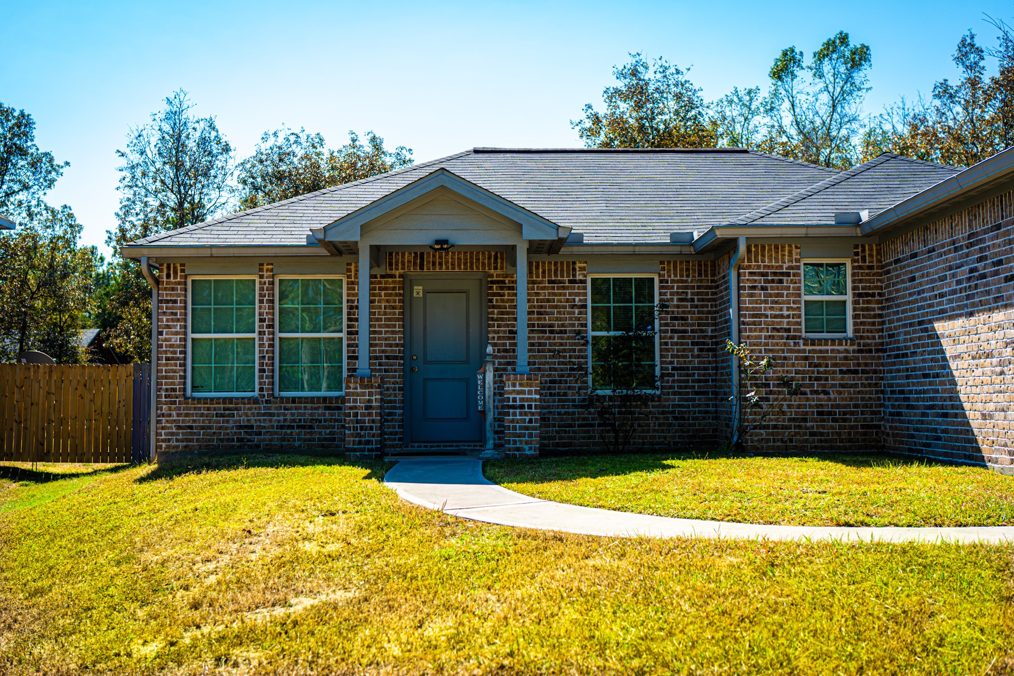 3940 Frontier Road Willis, TX 77378 - Photo 2 of 13 a front view of a house having yard