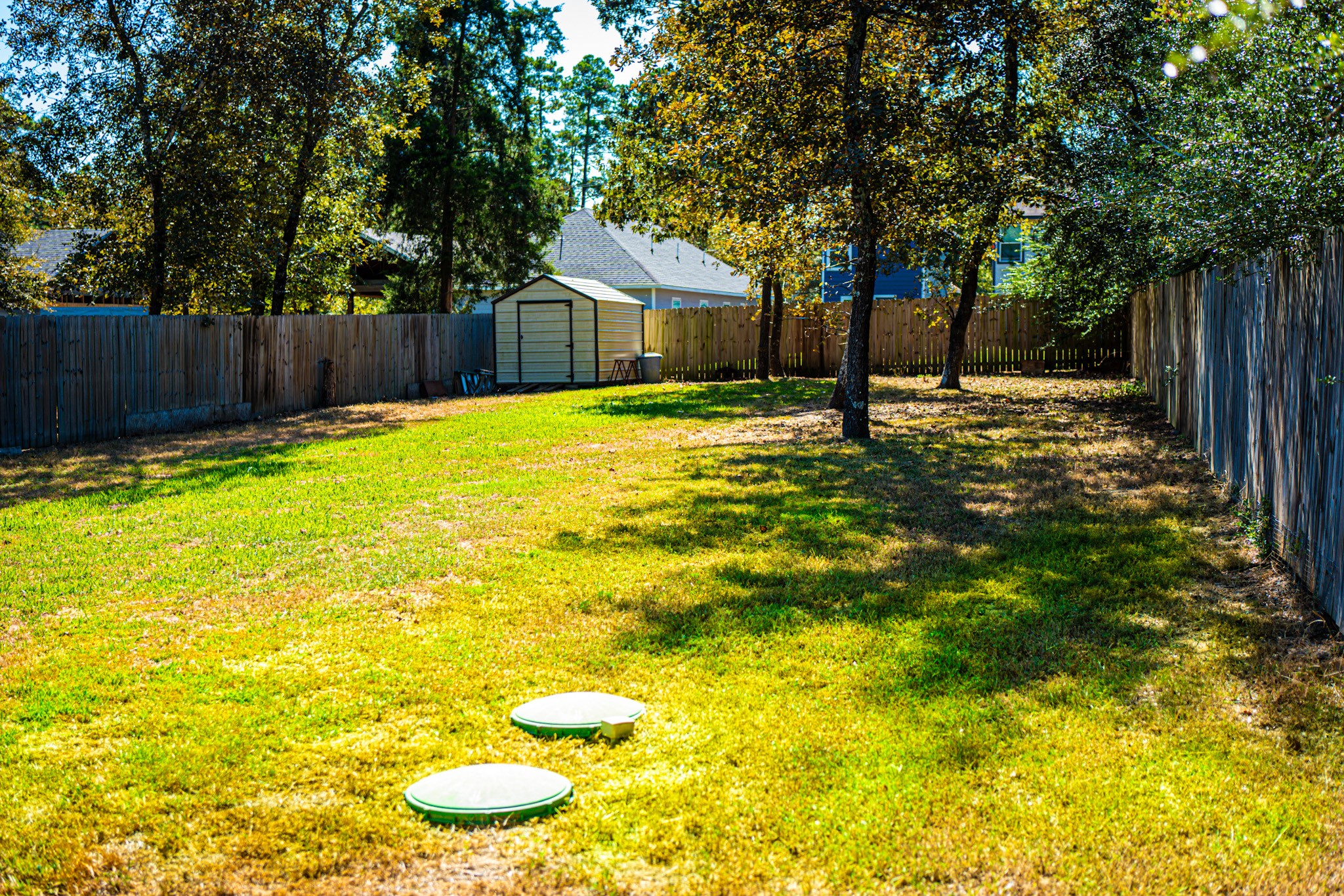 3940 Frontier Road Willis, TX 77378 - Photo 3 of 13 a swimming pool with wooden fence