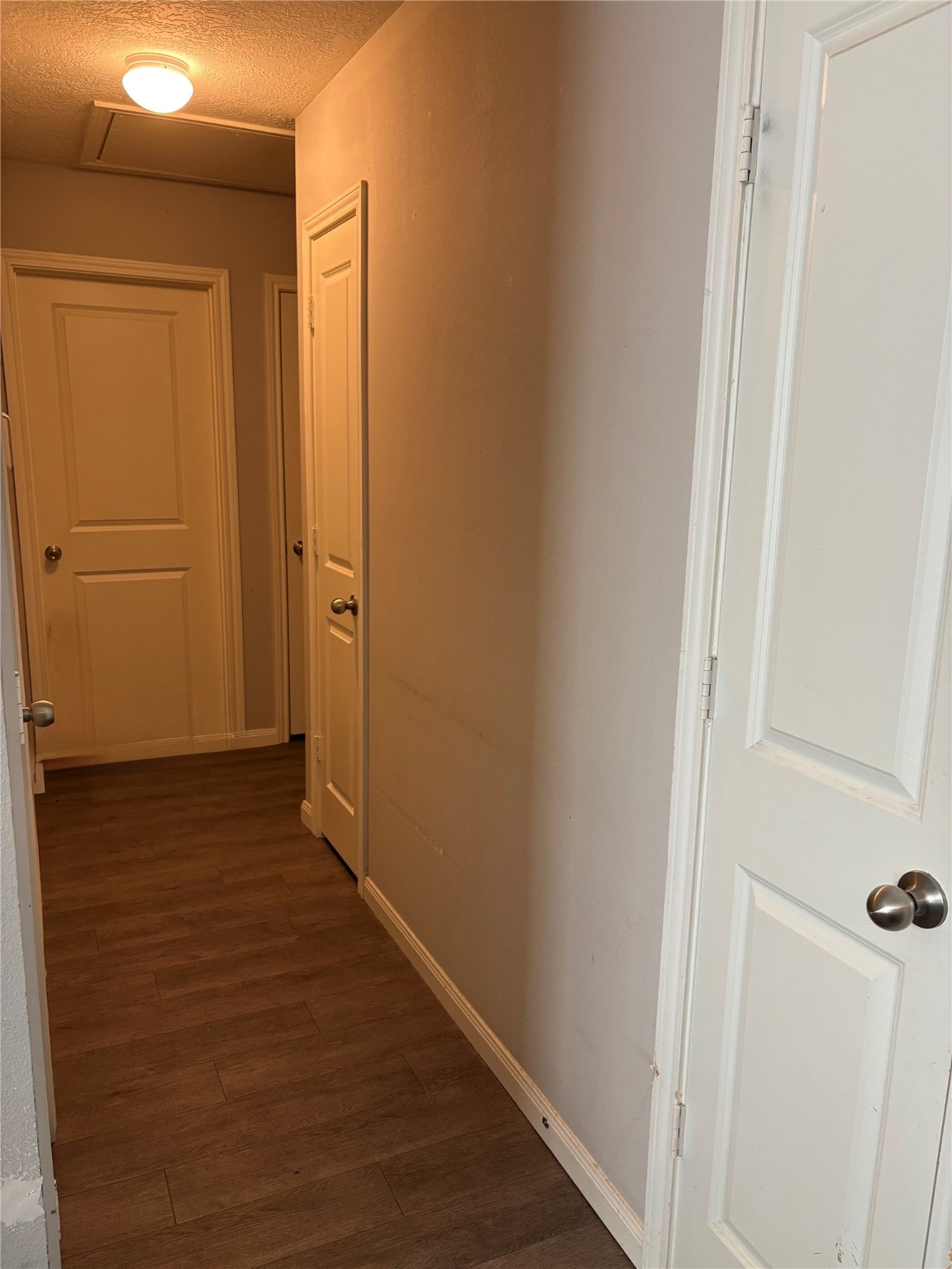 3940 Frontier Road Willis, TX 77378 - Photo 5 of 13 a view of a hallway with wooden floor