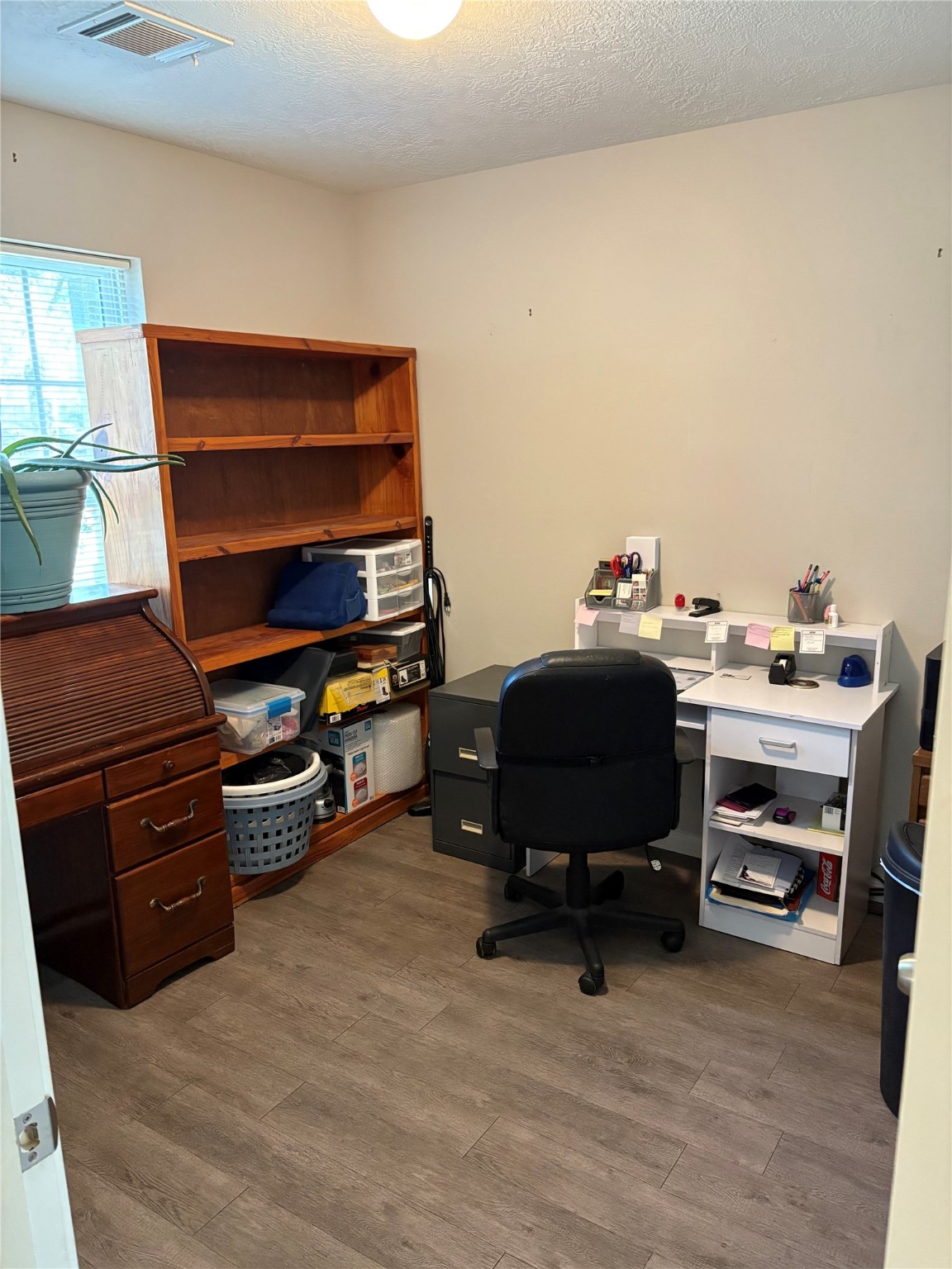 3940 Frontier Road Willis, TX 77378 - Photo 6 of 13 a room with furniture and a chair