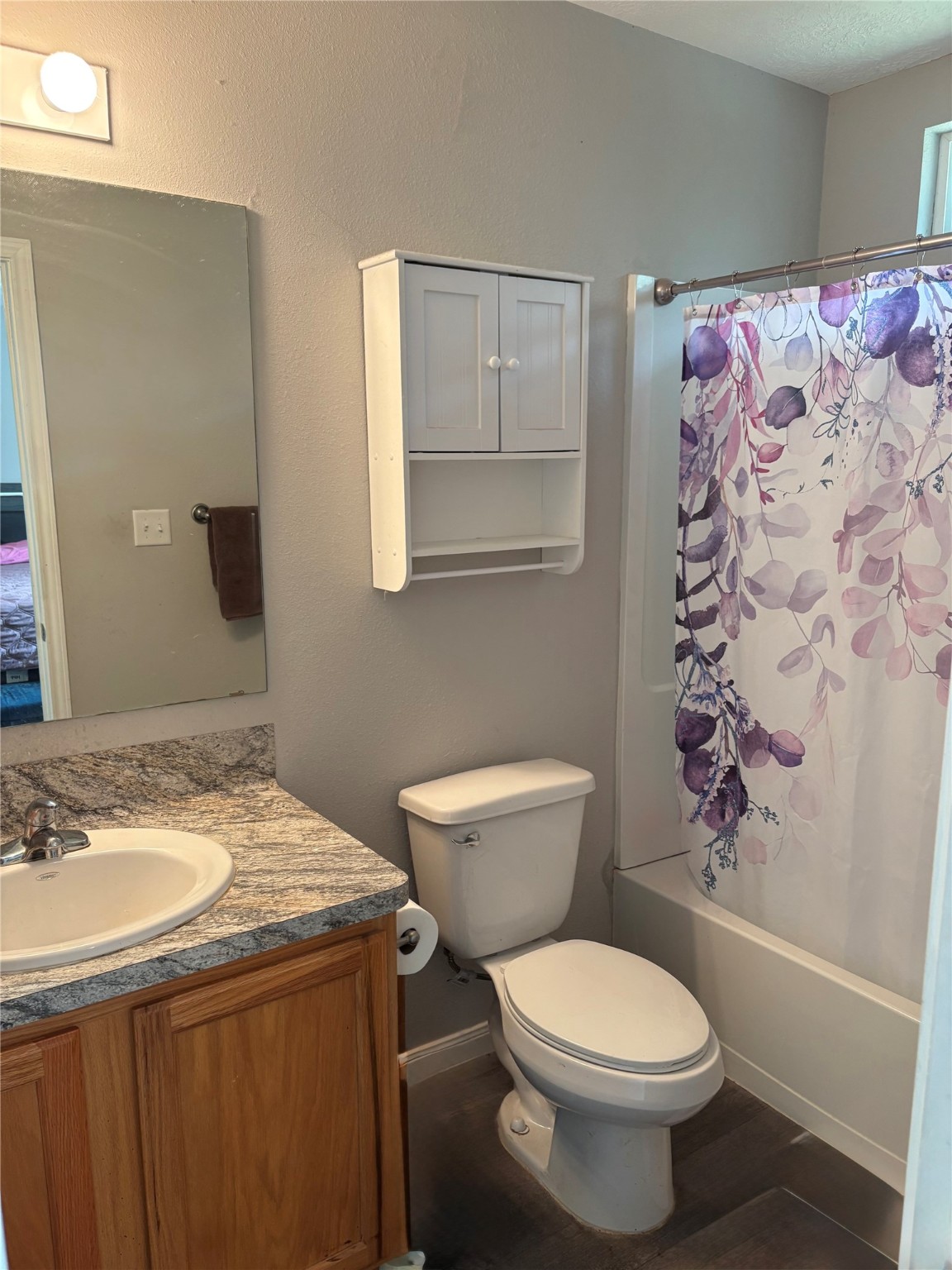 3940 Frontier Road Willis, TX 77378 - Photo 8 of 13 a bathroom with a sink toilet and shower