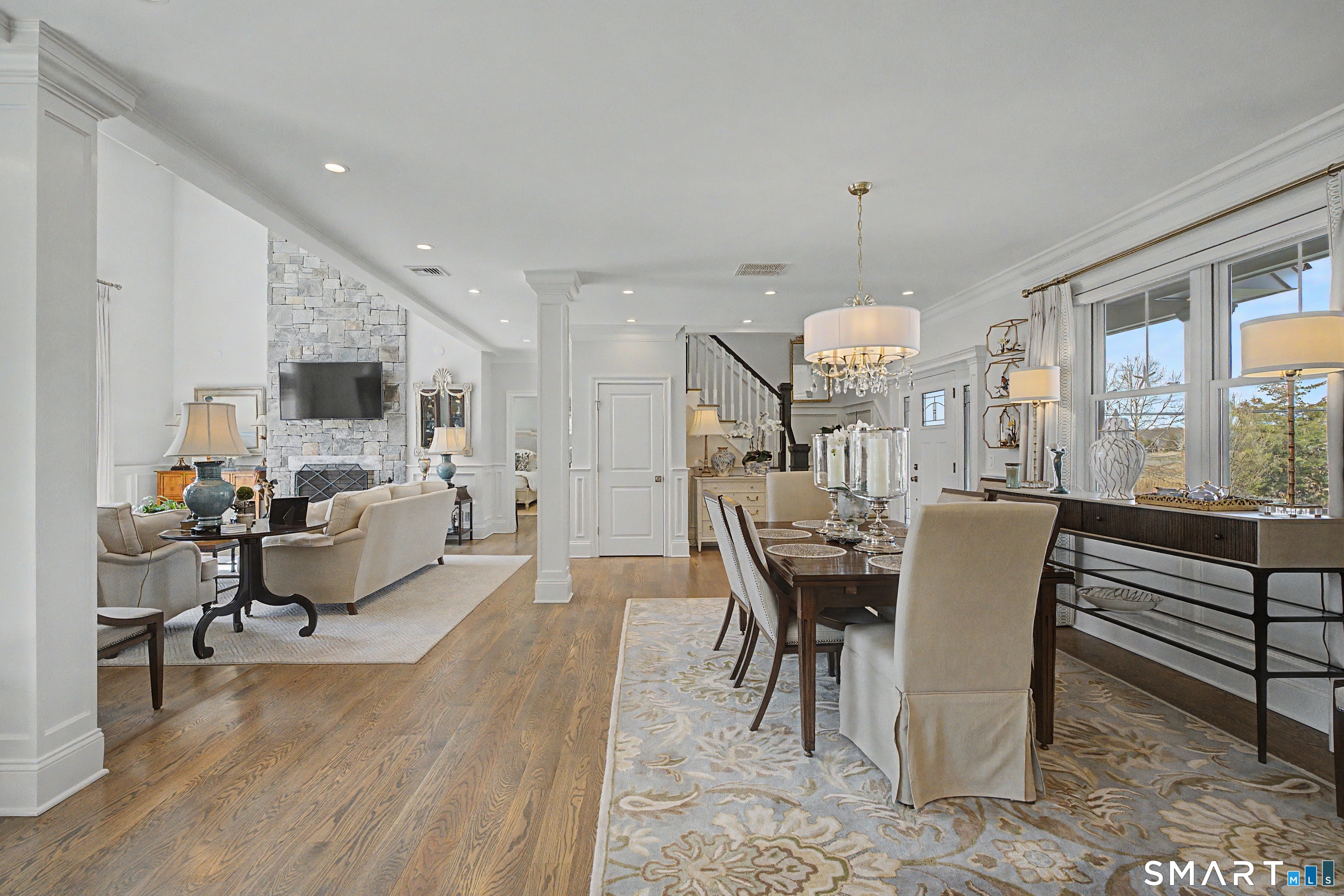 101 Garnet Park Road Madison, CT 06443 - Photo 11 of 40 a dining room with furniture a chandelier and wooden floor