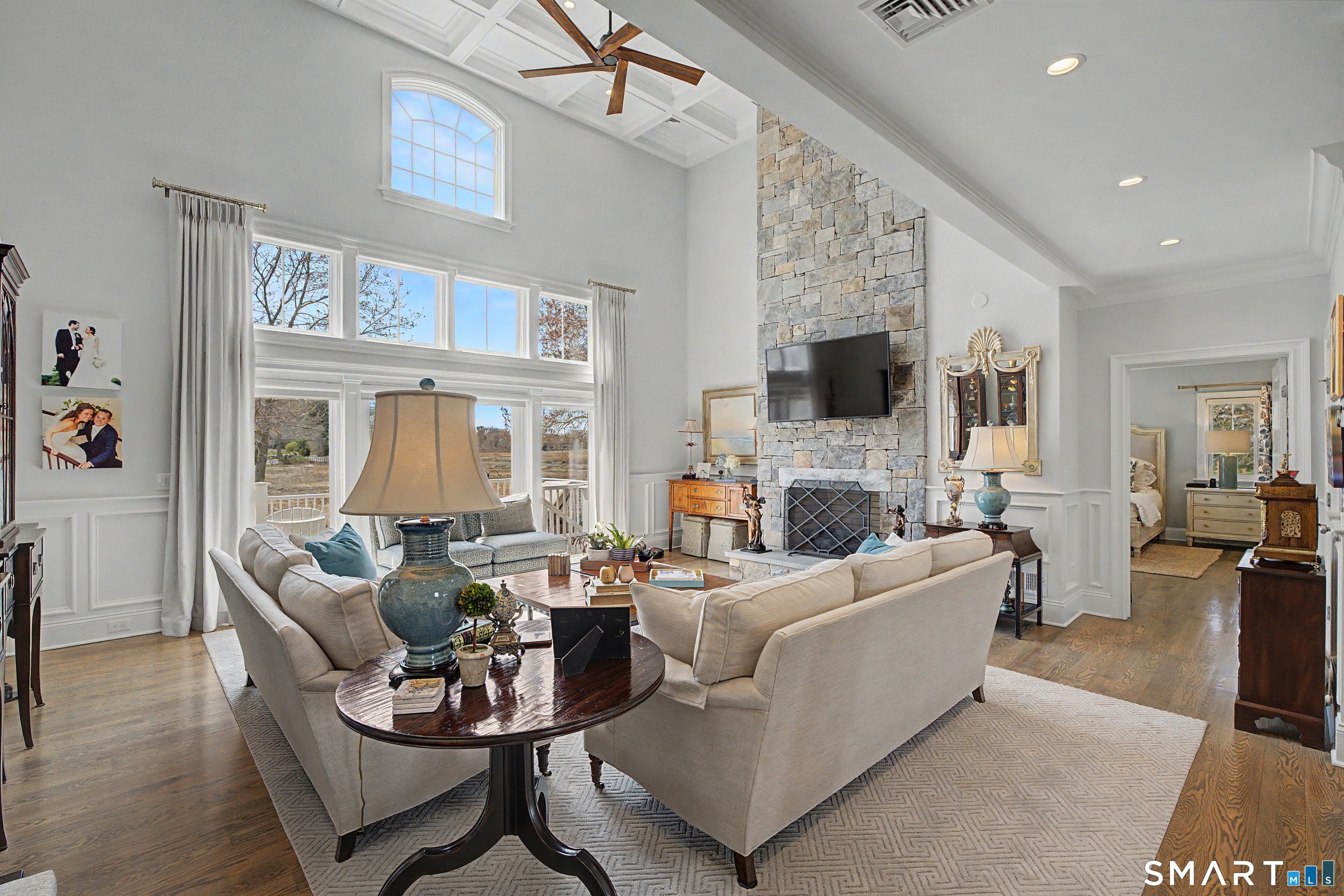 101 Garnet Park Road Madison, CT 06443 - Photo 13 of 40 a living room with fireplace furniture and a flat screen tv