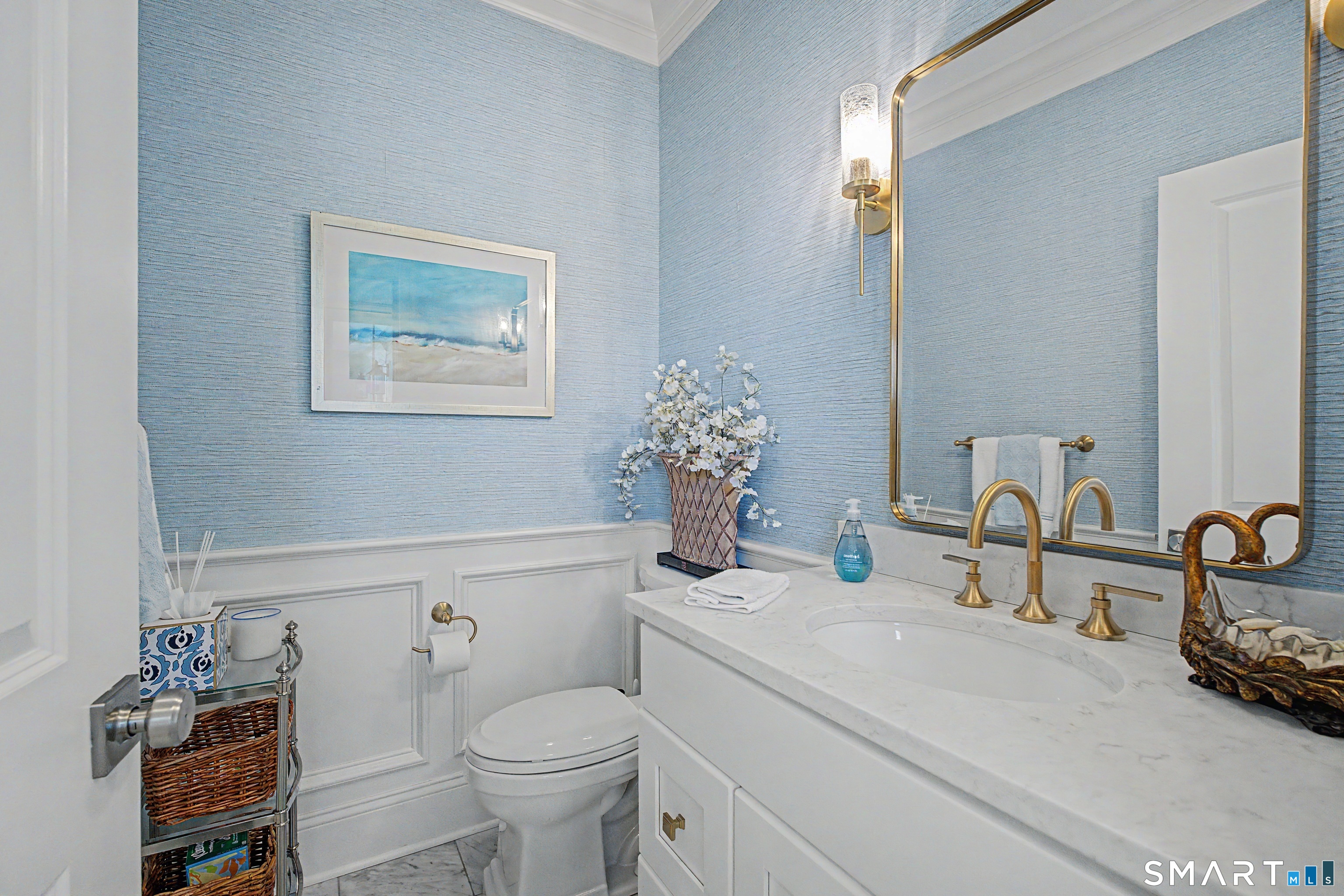 101 Garnet Park Road Madison, CT 06443 - Photo 22 of 40 a bathroom with a toilet sink and mirror
