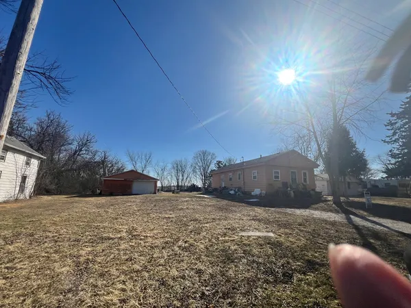 a view of a couches under an umbrella