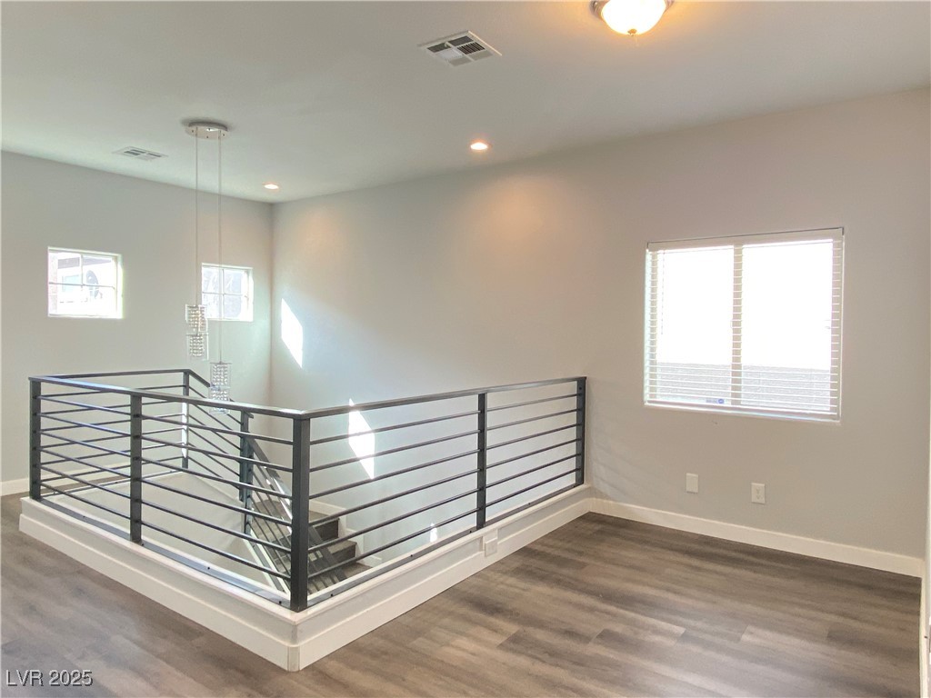 9637 Greensburg Avenue Las Vegas, NV 89178 - Photo 19 of 33 Spare room featuring recessed lighting, dark wood finished floors, visible vents, and baseboards