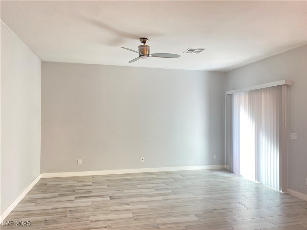 9637 Greensburg Avenue Las Vegas, NV 89178 - Photo 7 of 33 Spare room featuring a ceiling fan, baseboards, visible vents, and light wood finished floors