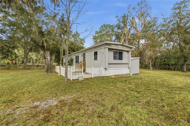 a house with trees in front of it