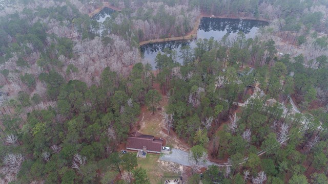 6815 Cartledge Road Box Springs, GA 31801 - Photo 2 of 27 a aerial view of a house with a yard