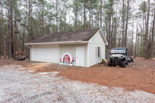 6815 Cartledge Road Box Springs, GA 31801 - Photo 23 of 27 a view of a house with a patio