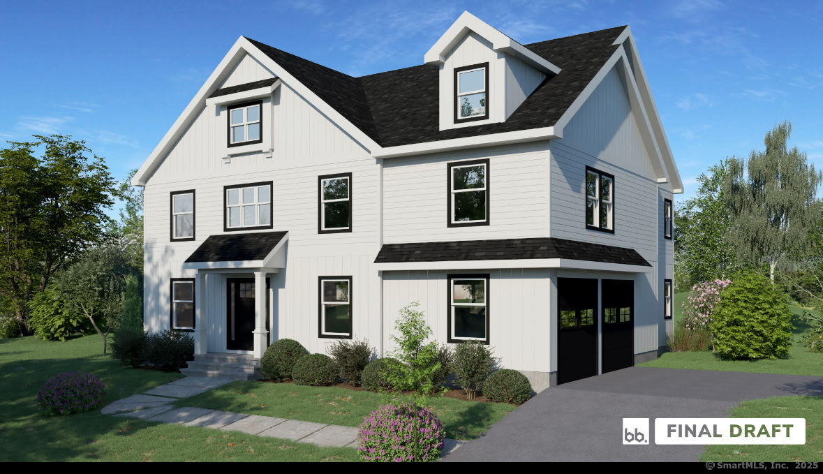75 A New Street Ridgefield, CT 06877 - Photo 2 of 8 a view of a white house with large windows and a small yard