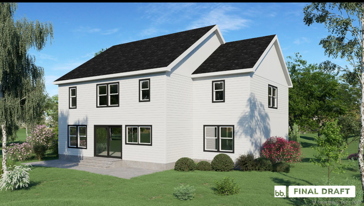 75 A New Street Ridgefield, CT 06877 - Photo 3 of 8 a front view of a house with a yard