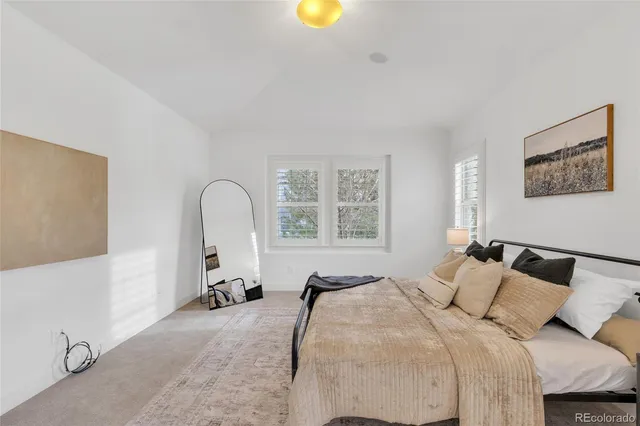 a view of a livingroom with furniture and a window