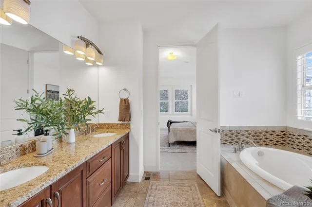 a utility room with sink dryer and washer