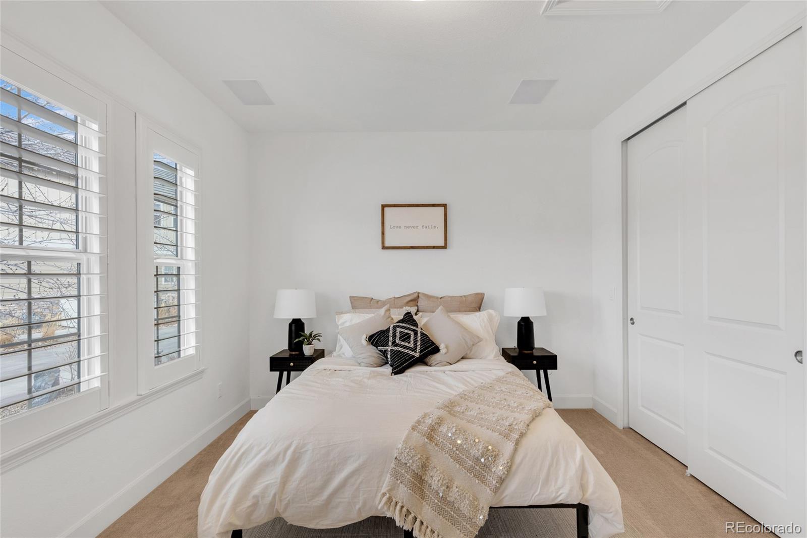 10632 Star Thistle Court Highlands Ranch, CO 80126 - Photo 23 of 50 a bedroom with a bed and a large window