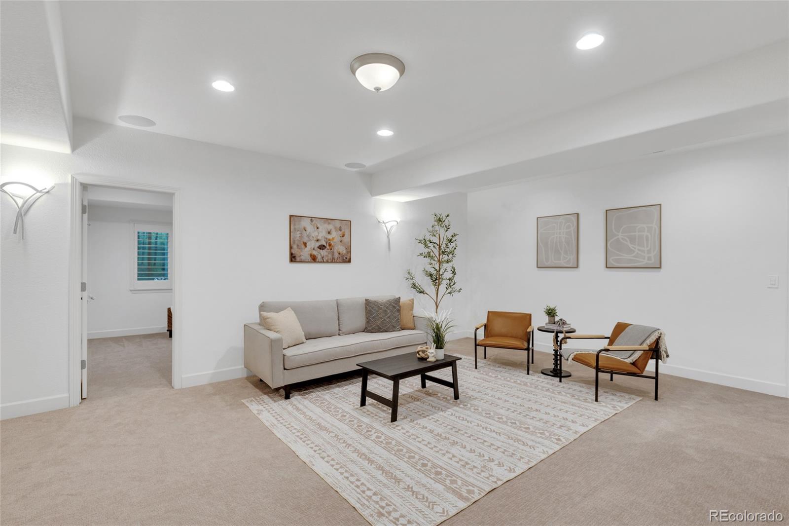 10632 Star Thistle Court Highlands Ranch, CO 80126 - Photo 29 of 50 a living room with furniture and a potted plant