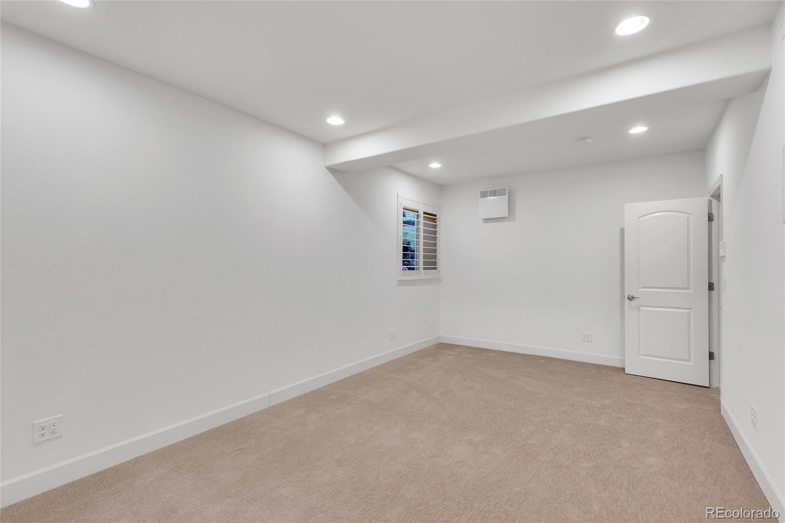 10632 Star Thistle Court Highlands Ranch, CO 80126 - Photo 36 of 50 an empty room with a empty space and windows
