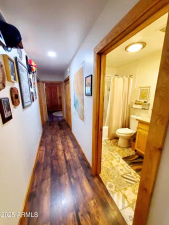 a bedroom with a bed dresser and a window