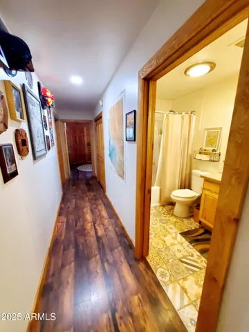 a bedroom with a bed dresser and a window