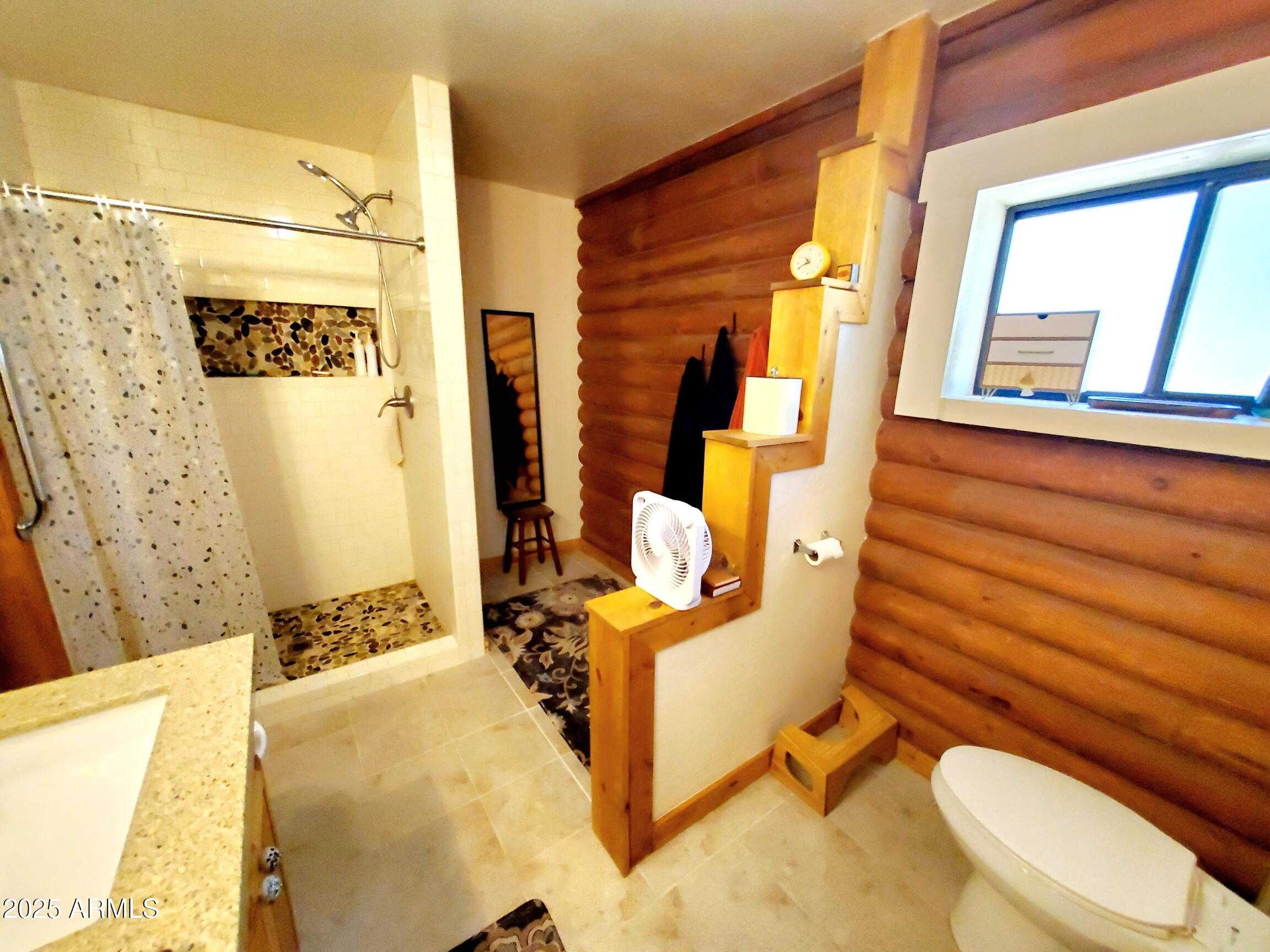 367 River Road Payson, AZ 85541 - Photo 25 of 44 a bedroom with a bed and wooden floor