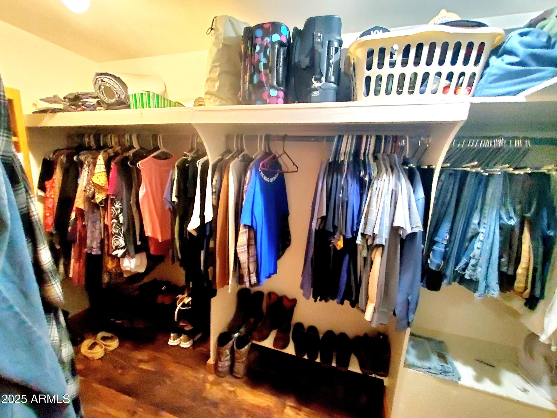 367 River Road Payson, AZ 85541 - Photo 26 of 44 a view of walk in closet with clothes and shoes