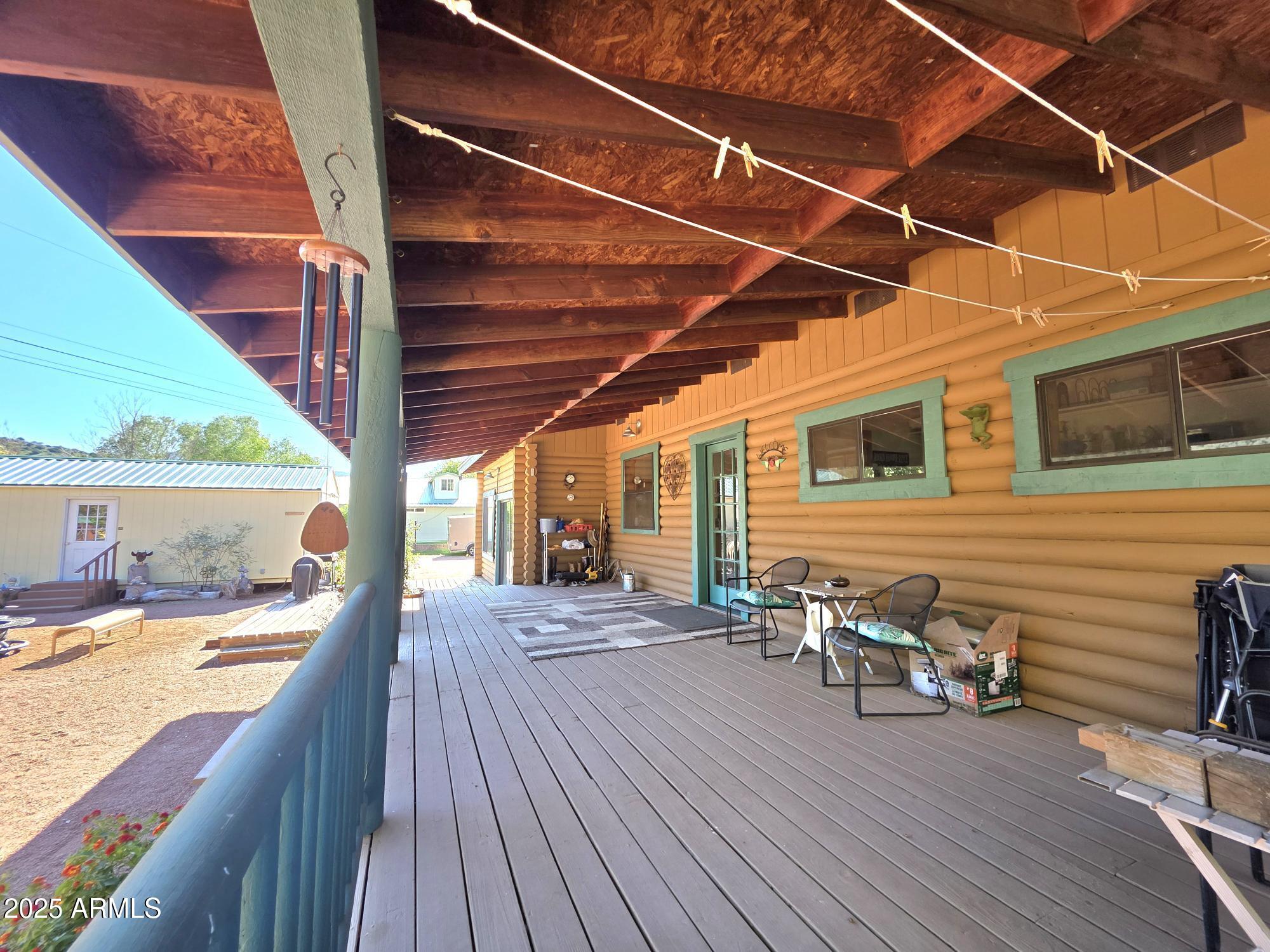 367 River Road Payson, AZ 85541 - Photo 41 of 44 a view of a balcony with chairs and wooden floor