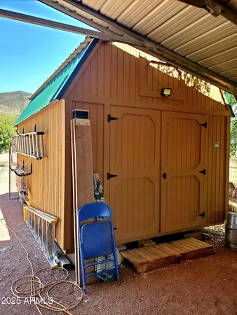 a view of backyard with cabin
